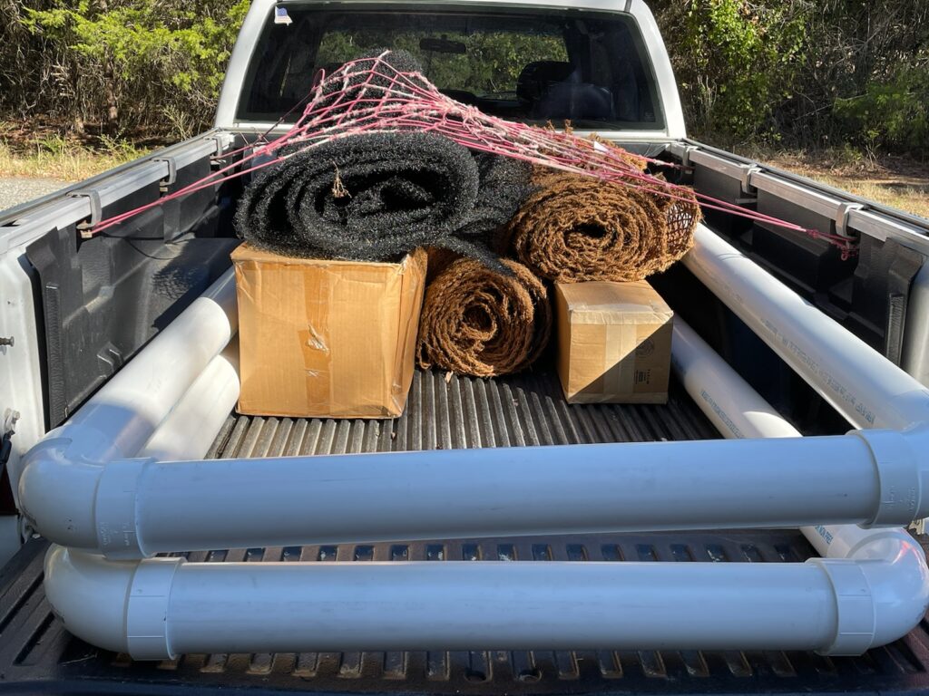 back of pickup truck loaded with materials to build a floating wetland; workshop tomorrow